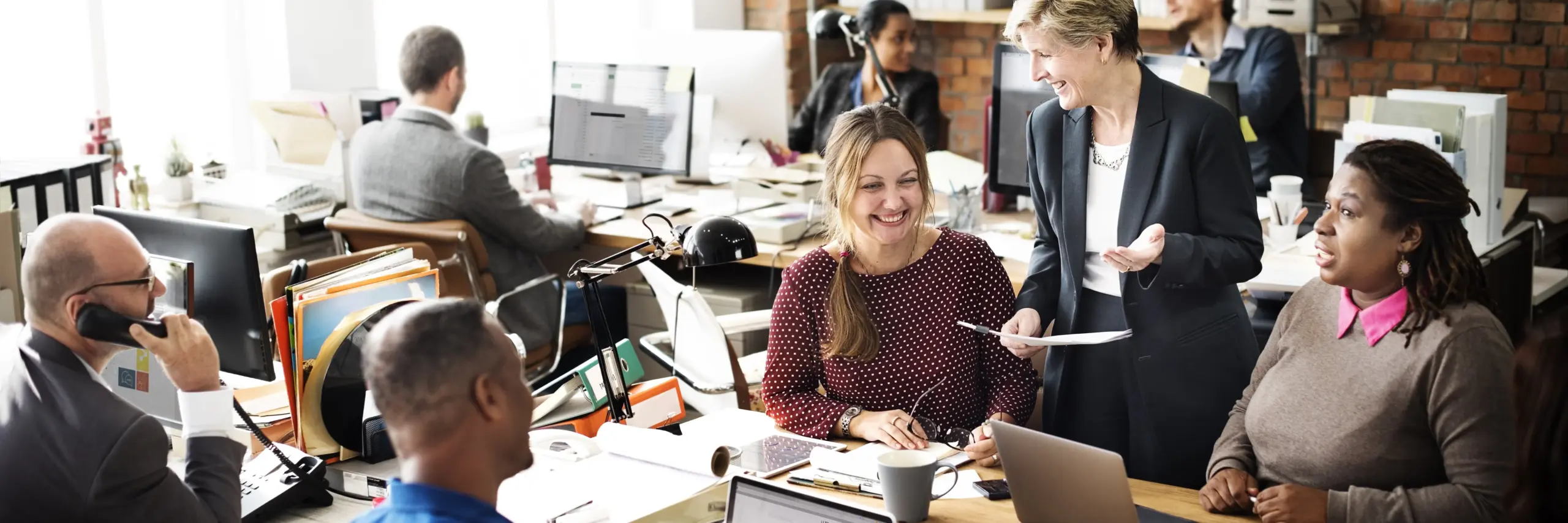smiling happy people in an office