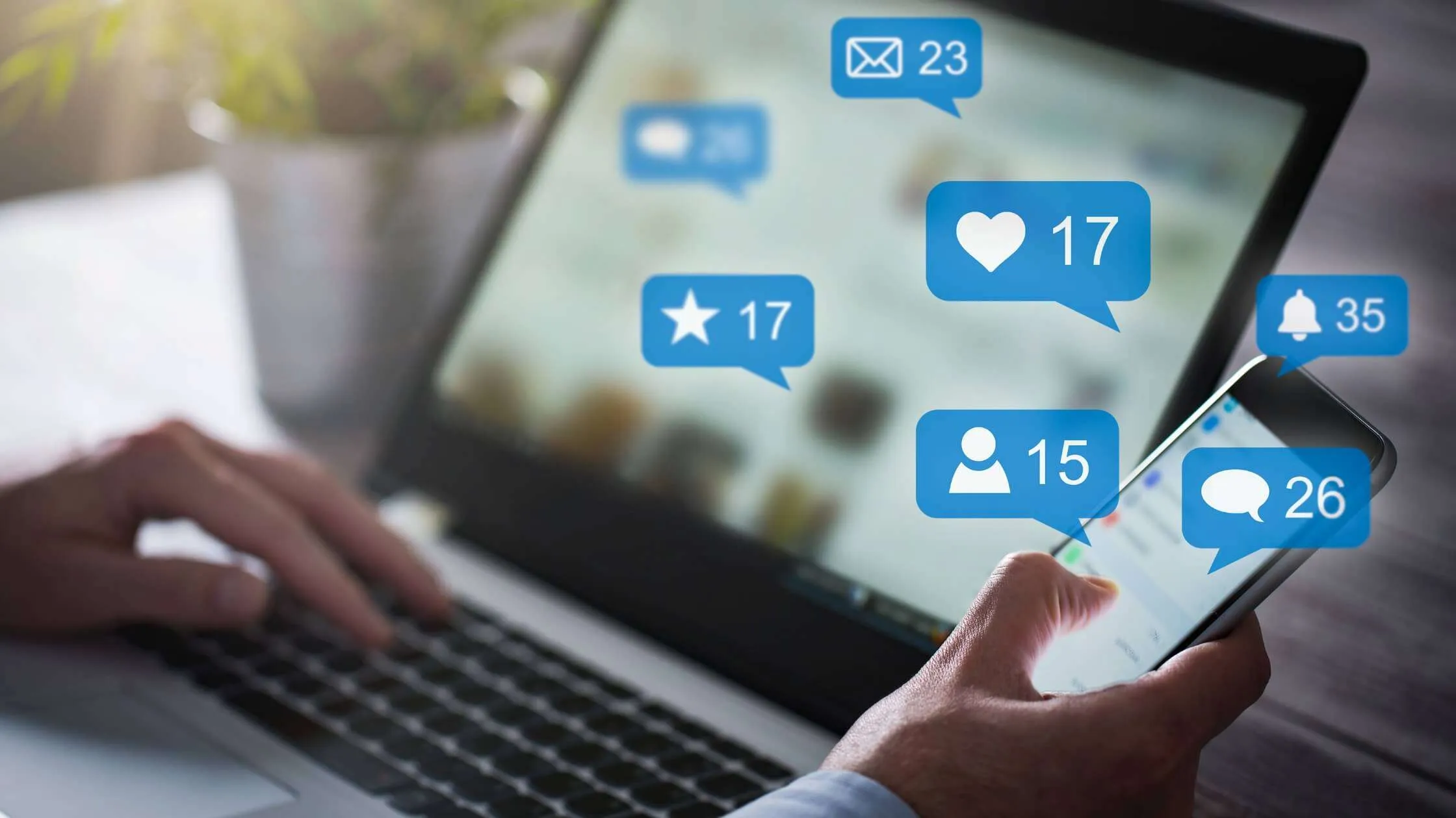 Man using social media on a laptop and phone with super imposed messaging bubbles and notifications.